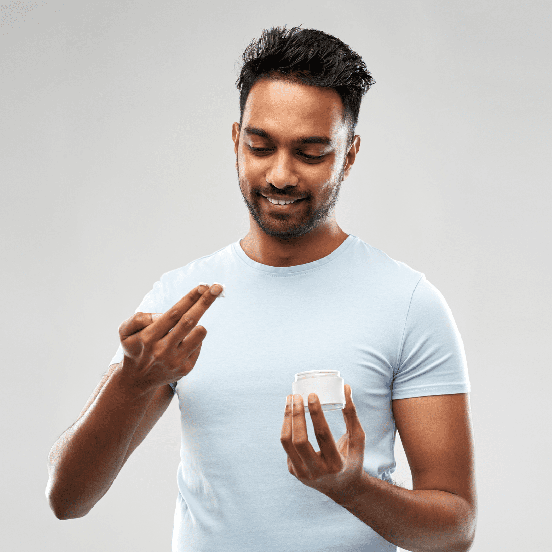 Man applying emollient